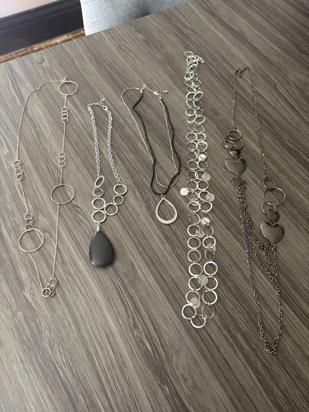 Lot of 5 silver tone necklaces with pendants